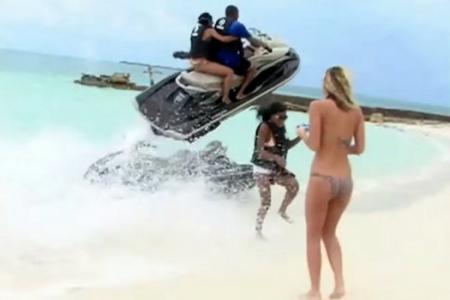 Watch flying jetski as it narrowly misses woman's head 