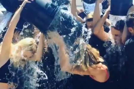 More ice bucket fun as Taylor and Robert Downey Jr join in