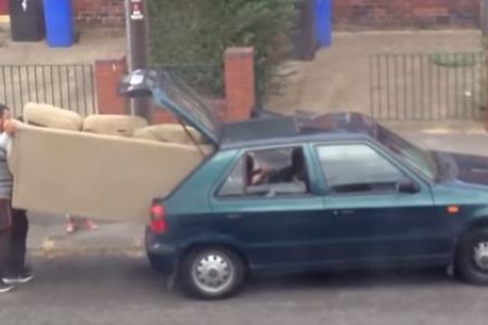 Watch as family tries to fit a whole sofa into their small car