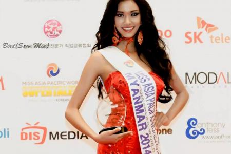 Dethroned Myanmar beauty queen runs off with crown, free breast implants