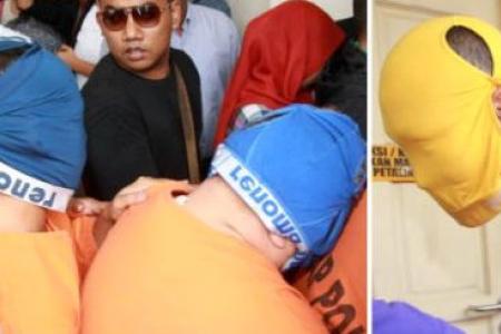 Head-turning stunt: M'sia customs officers don underwear to hide identity 