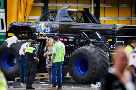 Spectator films monster truck as it comes towards him and crashes into crowd