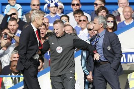 Wenger apologises for shoving Mourinho