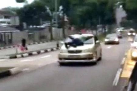 Man hangs on to moving car for 5km