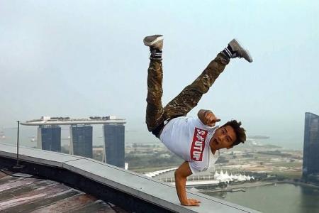 Flirting with death? Korean breakdancer does handstand on edge of Swissotel helipad