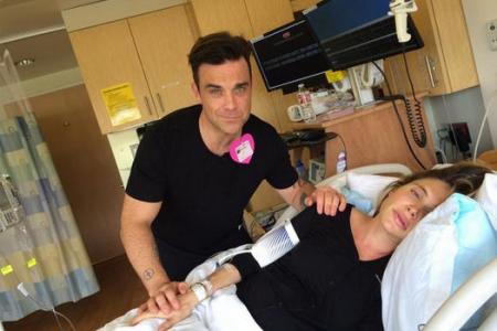 Bizarre? Robbie Williams live blogs his wife's delivery and sings 'Let It Go' 