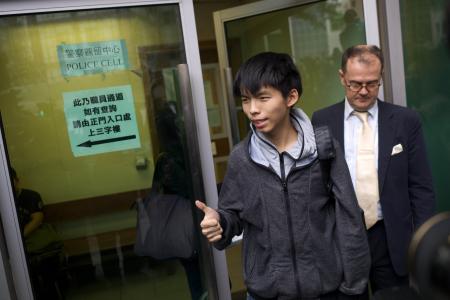 Police ‘pressed me to the ground’, claims HK student leader Joshua Wong