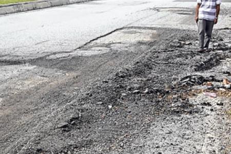 Pothole-fixing bikers criticised for repairing roads in Kuala Lumpur 