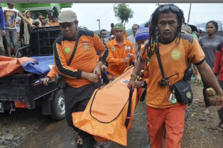 Twelve dead, 100 missing in Indonesian landslide