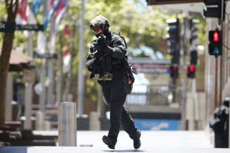 Update: NSW police confirms hostages held by gunman in Sydney cafe
