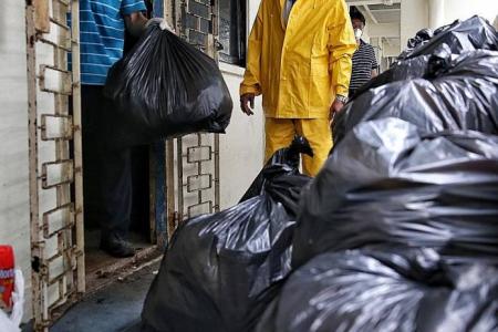 Big smiles after cleanup at hoarder's flat