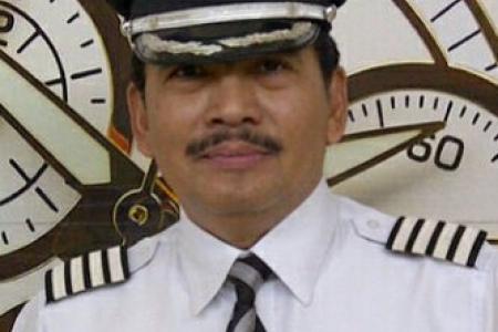 AirAsia QZ8501 pilot's son 'thinks daddy is still at work' 