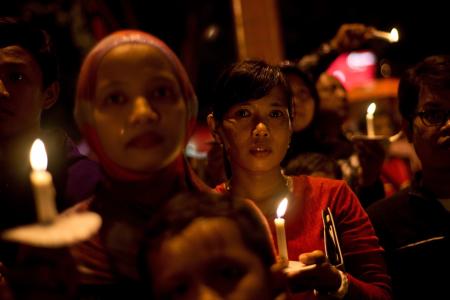 New Year celebrations in Malaysia and Indonesia sombre amidst floods and AirAsia tragedy
