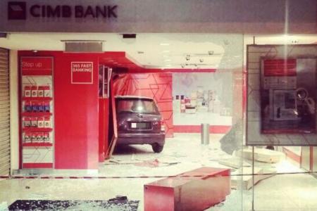 Elderly man crashes car into bank in M'sia