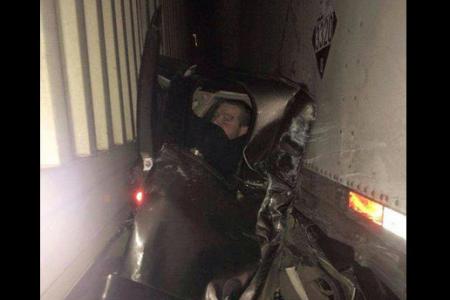Man crushed between two trucks escapes death, decides to have his picture taken