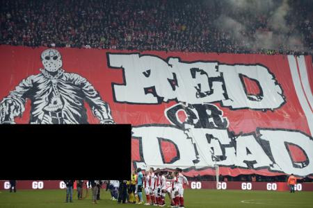 Fans behind banner showing player's decapitation face five-year ban