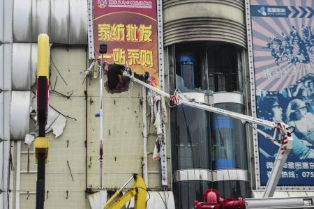 Boy, nine, detained after China mall fire kills 17