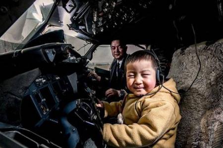Boy, four, who lost both his legs in an accident, gets to 'fly' aircraft