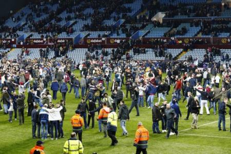 Football Association to investigate pitch invasion after Aston Villa win 