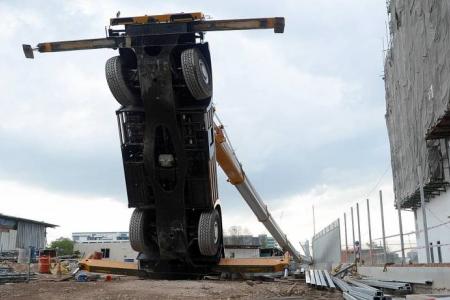 Mobile crane topples over