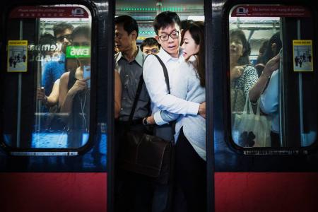 Faces on the MRT: S'pore photographer snaps expressions of peak hour commuters