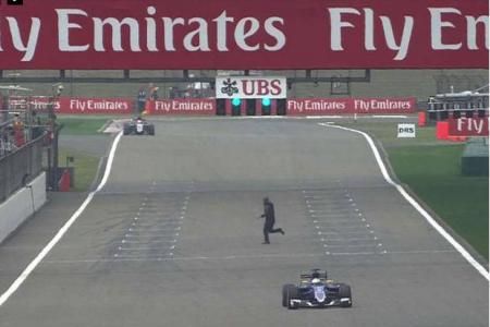 Formula One: ‘Crazed’ fan invades track at Chinese GP