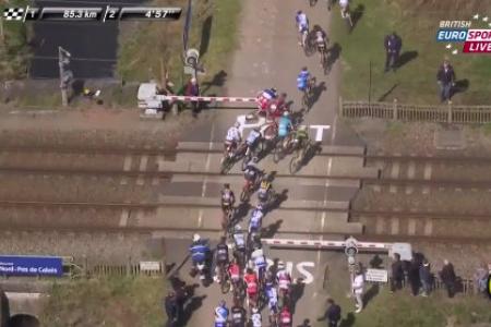 Watch: Cyclists in the Paris - Roubaix race narrowly avoid getting hit by train 
