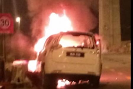 Malaysian policeman rescues man from car fire