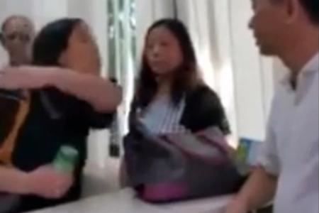 Women spit, slap and splash drink on condo staff member