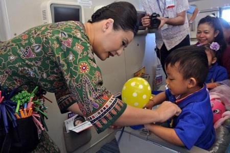 SIA's SG50 charity flight brings joy to 300 disadvantaged people