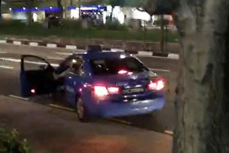Cabby drives off with man's legs sticking out of door