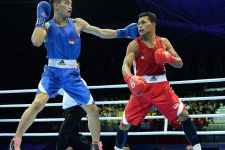 Singapore boxer punches above weight to reach last four