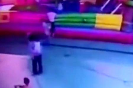 Toddler falls to death after gust blows away bouncy castle