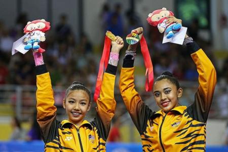 Malaysians claim surprise joint-gold in gymnastics