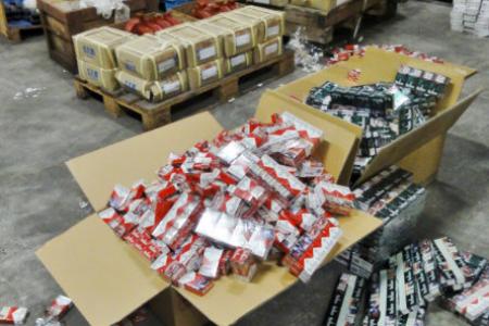 Three S'poreans charged for contraband cigarette activities