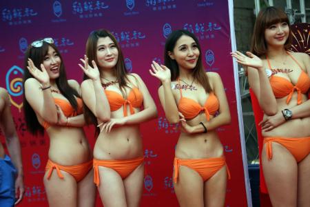 Restaurant in China boosts business by hiring scantily clad servers