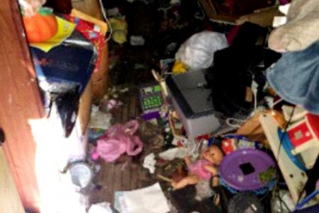 Girl, 7, rescued from horror house filled with trash, faeces and pests