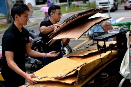 Youths learn why the elderly collect cardboard