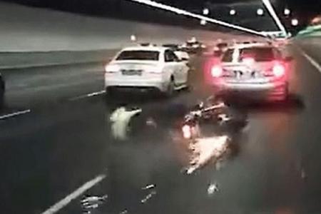 Couple hurt after bike hits braking car