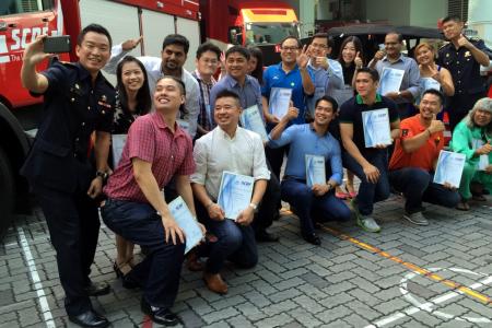 Watch: SCDF awards 16 for helping to save man pinned under truck