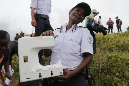 MH370 window frame or sewing machine part? Speculation rises over Reunion Island debris