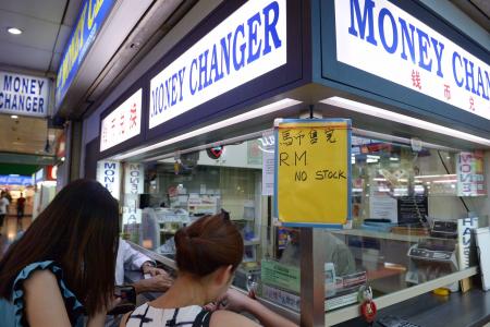 Singaporeans flock to money changers as ringgit hits 20-year low