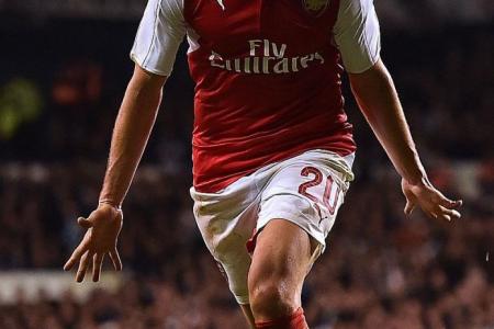 Flamini sparks Arsenal as Tottenham continue to pay for slack transfer policy