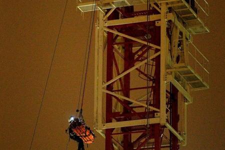 SCDF mounts dramatic rescue from crane