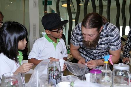 Wrestler Daniel Bryan teaches kids how to build terrarium