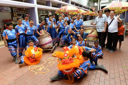 Young multi-racial lion dance troupe perform at Bukit Merah celebrations