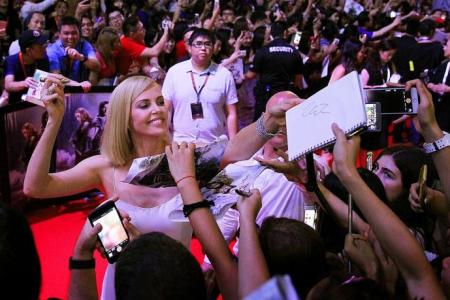Teen fan feels faint after hugging Charlize Theron