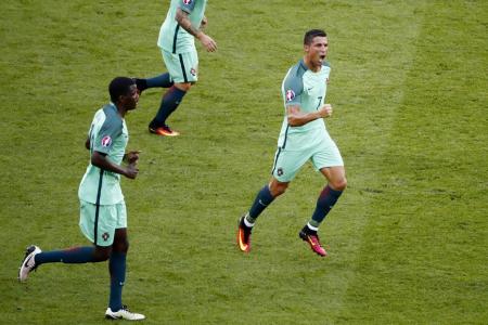 Ronaldo finds his magic to get Portugal through with Hungary draw
