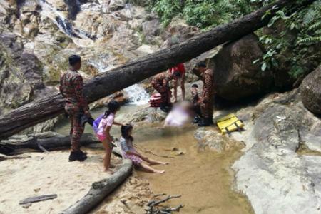 Singapore man dies trying to save daughter at Johor waterfall