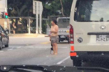 Topless woman on Nicoll Highway arrested